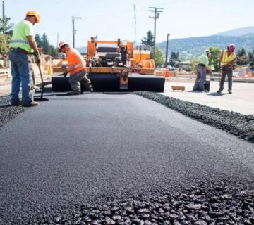 Construction workers laying fresh asphalt on a road photo 360x320